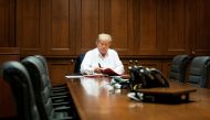 U.S. President Donald Trump works in a conference room while receiving treatment after testing positive for the coronavirus disease (COVID-19) at Walter Reed National Military Medical Center in Bethesda, Maryland, U.S. October 3, 2020. Joyce N. Boghosia/T