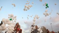 People release balloons during an event to commemorate the victims of the August 4 port explosion and to mark two months since the blast, near the port in Beirut, Lebanon October 4, 2020. REUTERS/Mohamed Azakir
