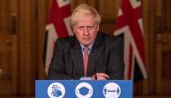 Britain's Prime Minister Boris Johnson attends a remote press conference to update the nation on the COVID-19 pandemic, inside 10 Downing Street in central London on September 30, 2020, the 100th coronavirus briefing since the pandemic hit the UK. / AFP /