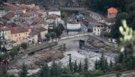 A picture taken on October 5, 2020 shows an aerial view of Breil-sur-Roya, a French village close to the Italian border, where houses were buried in mud and turned-over cars were stuck in the riverbed following heavy rains and floods. / AFP / Valery HACHE