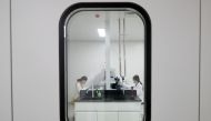 Women work in a laboratory of Chinese vaccine maker Sinovac Biotech, developing an experimental coronavirus disease (COVID-19) vaccine, during a government-organized media tour in Beijing, China, September 24, 2020. REUTERS/Thomas Peter/File Photo/File Ph