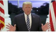 FILE PHOTO: U.S. President Donald Trump speaks at the White House after returning from hospitalization at the Walter Reed Medical Center for coronavirus disease (COVID-19) treatment, in Washington, October 5, 2020, in this still image from video posted on