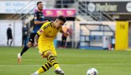 FILE PHOTO: Soccer Football - Bundesliga - SC Paderborn v Borussia Dortmund - Benteler Arena, Paderborn, Germany - May 31, 2020 Borussia Dortmund's Jadon Sancho scores their sixth goal, as play resumes behind closed doors following the outbreak of the cor