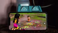 In this photo taken on October 7, 2020, a child watches 'Mighty Little Bheem' cartoon series on a mobile phone at home in New Delhi. It was a quest worthy of a superhero.  Ammu KANNAMPILLY / AFP / Sajjad HUSSAIN