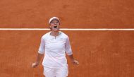 Poland's Iga Swiatek celebrates after winning the French Open final against Sofia Kenin of the U.S. REUTERS/Christian Hartmann
