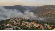 An aerial view shows smoke rising from a fire amid a heatwave in the Metn district of Mount Lebanon on October 9, 2020. / AFP 