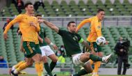 Wales' midfielder Kieffer Moore (L) and Wales' defender Connor Roberts (R) vie with Republic of Ireland's defender Shane Duffy during the UEFA Nations League Group B4 football match between the Republic of Ireland and Wales at the The Aviva Stadium in Dub