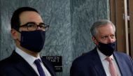 FILE PHOTO: U.S. Treasury Secretary Steve Mnuchin takes questions from news reporters with White House Chief of Staff Mark Meadows following a series of meetings on efforts to pass new coronavirus aid legislation on Capitol Hill in Washington, U.S., July 