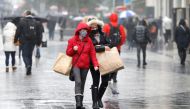 Women wearing face masks carry shopping bags amid the outbreak of the coronavirus disease (COVID-19) in Liverpool, Britain, October 12, 2020. Reuters/Phil Noble