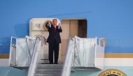 US President Donald Trump applauds as he disembarks from Air Force One for a campaign rally, his first since being treated for the coronavirus disease (COVID-19), at Orlando Sanford International Airport in Sanford, Florida, U.S., October 12, 2020. REUTER