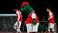 Arsenal's Joe Willock and Arsenal's Mesut Ozil with the mascot before the match REUTERS/Eddie Keogh 