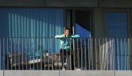 Portugal´s forward Cristiano Ronaldo giving the thumb up as he watches his teammates training session from a balcony at Portugal´s training camp in Oeiras, on the outskirts of Lisbon on October 13, 2020.  AFP / Portuguese Football Federation (FPF)
