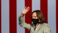 (FILES) In this file photo taken on October 02, 2020, Democratic vice presidential nominee Kamala Harris waves to supporters at a voter mobilization drive-in event in Las Vegas./ AFP / Ronda Churchill