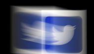 (FILES) This file photo illustration shows a Twitter logo displayed on a mobile phone on August 10, 2020, in Arlington, Virginia./ AFP / Olivier DOULIERY

