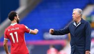 Liverpool's Egyptian midfielder Mohamed Salah (L) and Everton's Italian head coach Carlo Ancelotti react at the final whistle during the English Premier League football match between Everton and Liverpool at Goodison Park in Liverpool, north west England 