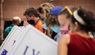 Voters cast their ballots in the voting booths at the early vote location at the Charleston Coliseum and Convention Center in North Charleston, South Carolina on October 16, 2020. Many states across the country have seen record turnout for early voting fo
