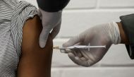 FILE PHOTO: A volunteer receives an injection from a medical worker during the country's first human clinical trial for a potential vaccine against the novel coronavirus, at the Baragwanath hospital in Soweto, South Africa, June 24, 2020. REUTERS/Siphiwe 
