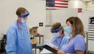 Medical personnel work inside a field hospital known as an Alternate Care Facility at the state fair ground as cases of coronavirus disease (COVID-19) cases spike in the state near Milwaukee, Wisconsin, U.S., October 12, 2020. Picture taken October 12, 20