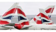 FILE PHOTO: British Airways aircraft are seen stationary on the tarmac of London's Heathrow Airport in west London, August 12, 2005. REUTERS/Toby Melville/File Photo