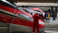 File photo: A worker cleans a window of the Frecciarossa's train at the Termini railway station in Rome, Italy, November 6, 2018. Reuters/Alessandro Bianchi/File Photo