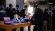 People look at Apple products at an Apple Store, as the coronavirus disease (COVID-19) outbreak continues in Shanghai China October 23, 2020. REUTERS/Aly Song
