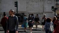 People cross a street at a traffic light during the coronavirus disease (COVID-19) outbreak, in downtown Lisbon, Portugal October 9, 2020. REUTERS/Rafael Marchante/File Photo/File Photo