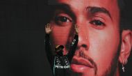 October 25, 2020 Mercedes' Lewis Hamilton celebrates winning the race on the podium Pool via REUTERS/Jose Sena Goulao