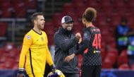 Liverpool's German coach Jurgen Klopp (C) celebrates with Liverpool's English defender Rhys Williams after winning the UEFA Champions League Group D first-leg football match between Ajax Amsterdam and Liverpool FC at the Johan Cruijff Arena in Amsterdam o