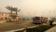 A fire truck is seen as the Silverado Fire is approaching, near Irvine, California, U.S. October 26, 2020. REUTERS/Mike Blake
