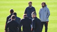 Juventus president Andrea Agnelli (C) and Juventus coach Andrea Pirlo (R) attend a training session on the eve of the UEFA Champions League football group G match Juventus vs F.C. Barcelona on October 27, 2020 at the Juventus Training Center in Turin. / A