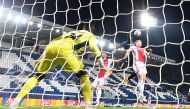 Atalanta's Colombian forward Duvan Zapata (C) heads the ball and scores during the UEFA Champions League group D football match, between Atalanta and Ajax at the Atleti Azzurri d'Italia stadium in Bergamo, northern Italy, on October 27, 2020. / AFP / Migu