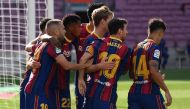Barcelona's Spanish midfielder Ansu Fati (3rdL) celebrates with teammates after scoring a goal during the Spanish League football match between Barcelona and Real Madrid at the Camp Nou stadium in Barcelona on October 24, 2020. / AFP / LLUIS GENE