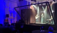 Singer-songwriter Dan Olsen and his guitarist use technology based on a Victorian optical illusion to demonstrate how Musion 3D's virtual concert system allows performers to connect with their fans in the locked-down world of the coronavirus pandemic, app