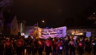 Protesters march through West Philadelphia on October 27, 2020, during a demonstration against the fatal shooting of 27-year-old Walter Wallace, a Black man, by police. AFP / GABRIELLA AUDI