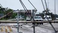View of fallen power lines after the passage of Hurricane Zeta, in Puerto Morelos, Quintana Roo state, Mexico, on October 27, 2020. Zeta was downgraded to a tropical storm on Tuesday after making a landfall on Monday night as a category 1 hurricane near t