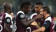 Paris Saint-Germain's Italian forward Moise Kean (L) celebrates with Paris Saint-Germain's Italian midfielder Alessandro Florenzi after scoring his team's first goal during the UEFA Champions League Group H football match between Istanbul Basaksehir FK an