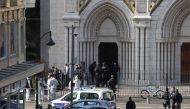 French members of the elite tactical police unit RAID enter to search the Basilica of Notre-Dame de Nice after a knife attack in Nice on October 29, 2020. AFP / Valery Hache 