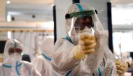 Members of medical staff wearing personal protective equipment (PPE) works in the Intensive Care Unit (ICU) for the Covid-19 (the novel coromavirus) cases, in the San Filippo Neri hospital in Rome, on October 29, 2020. / AFP / Tiziana FABI