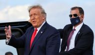 FILE PHOTO: U.S. President Donald Trump gestures as he prepares to get into a vehicle after arriving aboard Air Force One in Pope Field at Fort Bragg, North Carolina, U.S., October 29, 2020. REUTERS/Jonathan Ernst