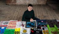 British artist Katrina Cobain, 24, poses for photographs with some of her collection of plastic bags from which she intends to start The Plastic Bag Museum in Glasgow on October 28, 2020.  AFP / ANDY BUCHANAN / TO GO WITH AFP STORY BY STUART GRAHAM
