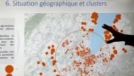 A County of GENEVA staff member shows the geographical spread of clusters during an update briefing in the contact tracing unit, as Switzerland enters a second wave of coronavirus disease (COVID-19) outbreak, in GENEVA, Switzerland, October 29, 2020. REUT
