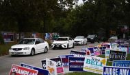 FILE PHOTO: A line of cars drive in for an event encouraging community members to vote in the upcoming presidential election at an early voting site in Houston, Texas, U.S., October 25, 2020. Picture taken October 25, 2020. REUTERS/Callaghan O'Hare/File P