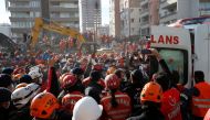 Rescuers carry 4-year-old Ayla Gezgin out from a collapsed building as operations take place on a site after an earthquake struck the Aegean Sea, in the coastal province of Izmir, Turkey, November 3, 2020. REUTERS/Kemal Aslan