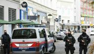 Policemen guard the area on November 3, 2020 close to a crime scene in Vienna after a shooting. A huge manhunt was under way Tuesday, November 3, 2020 after gunmen opened fire on November 2, 2020 at multiple locations across central Vienna, killing at lea
