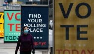 Video billboards urge people to vote at Lincoln Center on Election Day, November 3, 2020 in New York. Americans were voting on Tuesday under the shadow of a surging coronavirus pandemic to decide whether to reelect Republican Donald Trump, one of the most