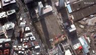 A satellite image shows rescue workers and a Turkish flag after the earthquake in Izmir, Turkey, November 3, 2020. Picture taken November 3, 2020. Satellite image ?2020 Maxar Technologies/Handout via REUTERS