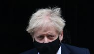Britain's Prime Minister Boris Johnson, wearing a face mask, leaves number 10 Downing Street in central London to take part in Prime Minister's Questions (PMQs) in Parliament on November 4, 2020. / AFP / DANIEL LEAL-OLIVAS