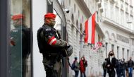 An armed member of the special forces stands guard near the site of a gun attack in Vienna, Austria, November 4, 2020. REUTERS/Leonhard Foeger