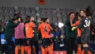 Istanbul Basaksehir FK players celebrates at the end of the UEFA Champions League football match group H, between Istanbul Basaksehir FK and Manchester United, on November 4, 2020, at the Basaksehir Fatih Terim stadium in Istanbul. / AFP / OZAN KOSE
