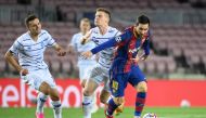 Barcelona's Argentine forward Lionel Messi (R) vies with Dynamo Kiev's Ukrainian defender Illia Zabarnyi during the UEFA Champions League group G football match between Barcelona and Dynamo Kiev at the Camp Nou stadium in Barcelona, on November 4, 2020. /